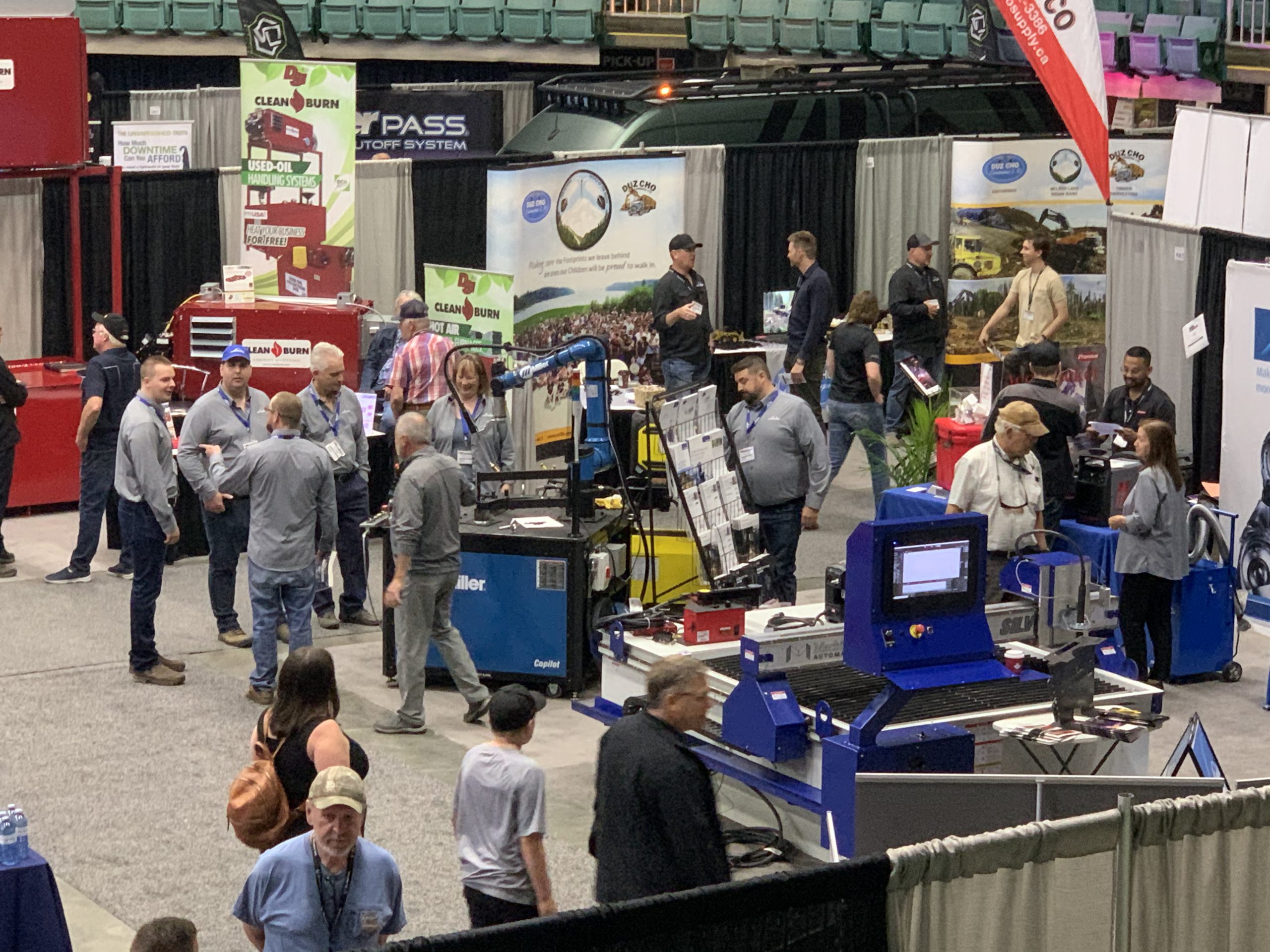 A large crowd networking at a heavy equipment trade show in British Columbia.